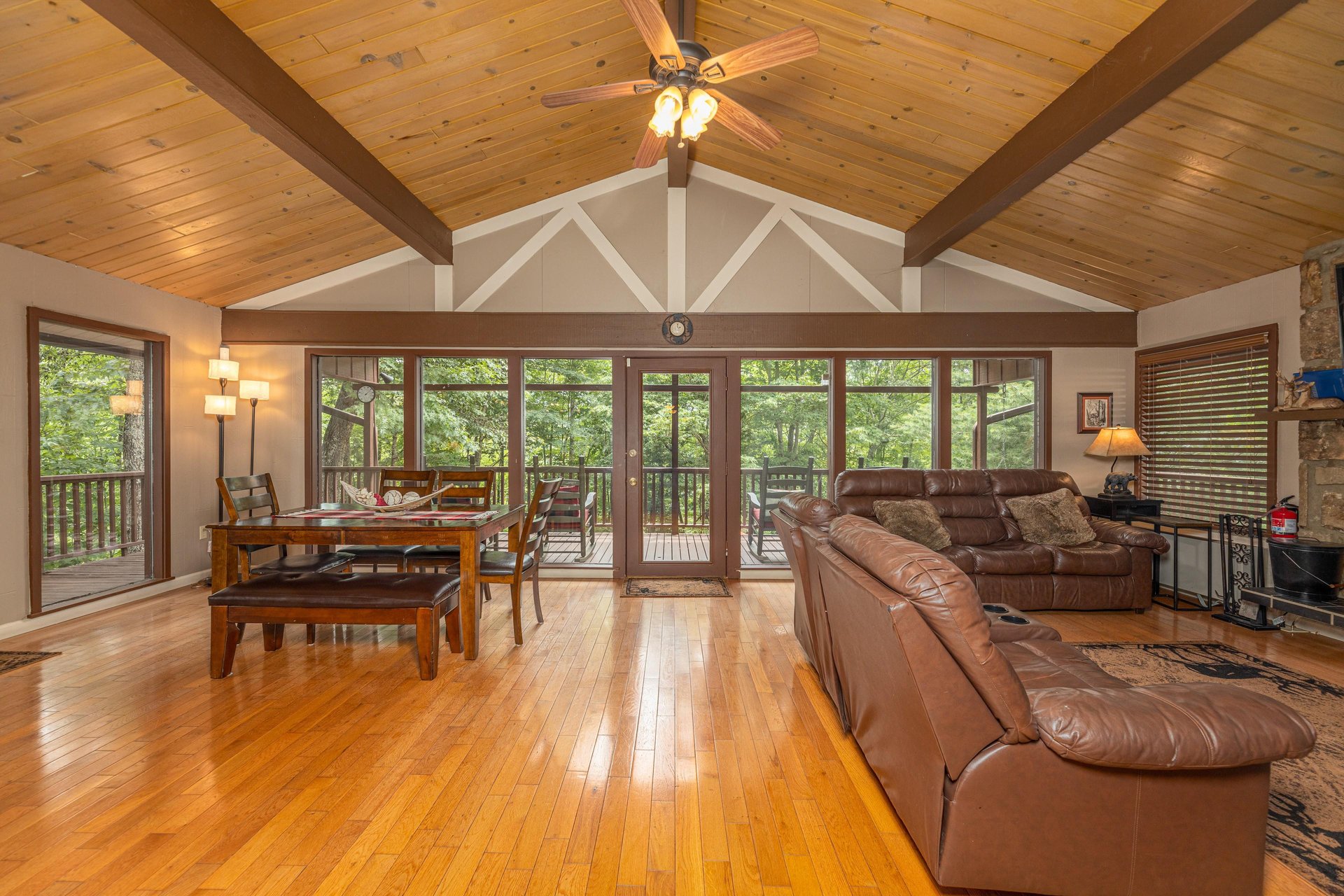 Deck entry into dining and living room seating at Buena Vista Getaway, 3 bedroom cabin rental located in Gatlinburg
