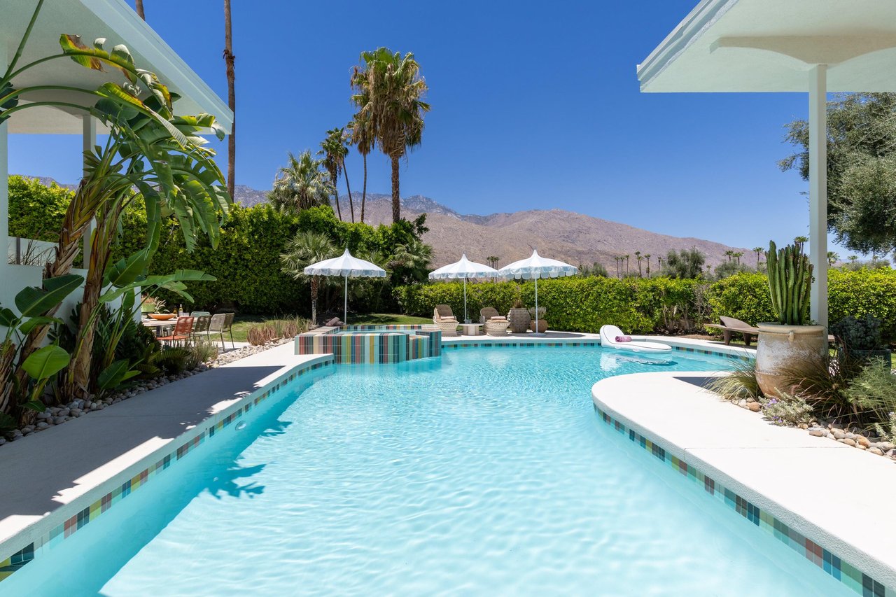Beautiful private pool and spa with colorful tiles. Sun loungers and umbrellas for guest use.