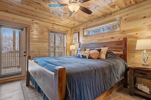 Drift off in this cozy log cabin bedroom where rustic wood walls and soft linens create your perfect mountain retreat.