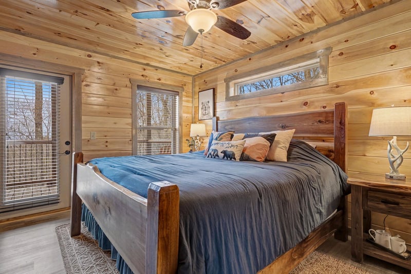 Drift off in this cozy log cabin bedroom where rustic wood walls and soft linens create your perfect mountain retreat.