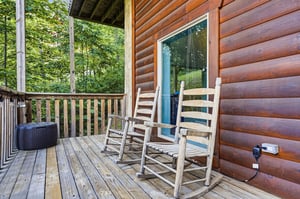 Unwind in your private rocking chairs on the covered deck, surrounded by peaceful forest views and fresh mountain air.
