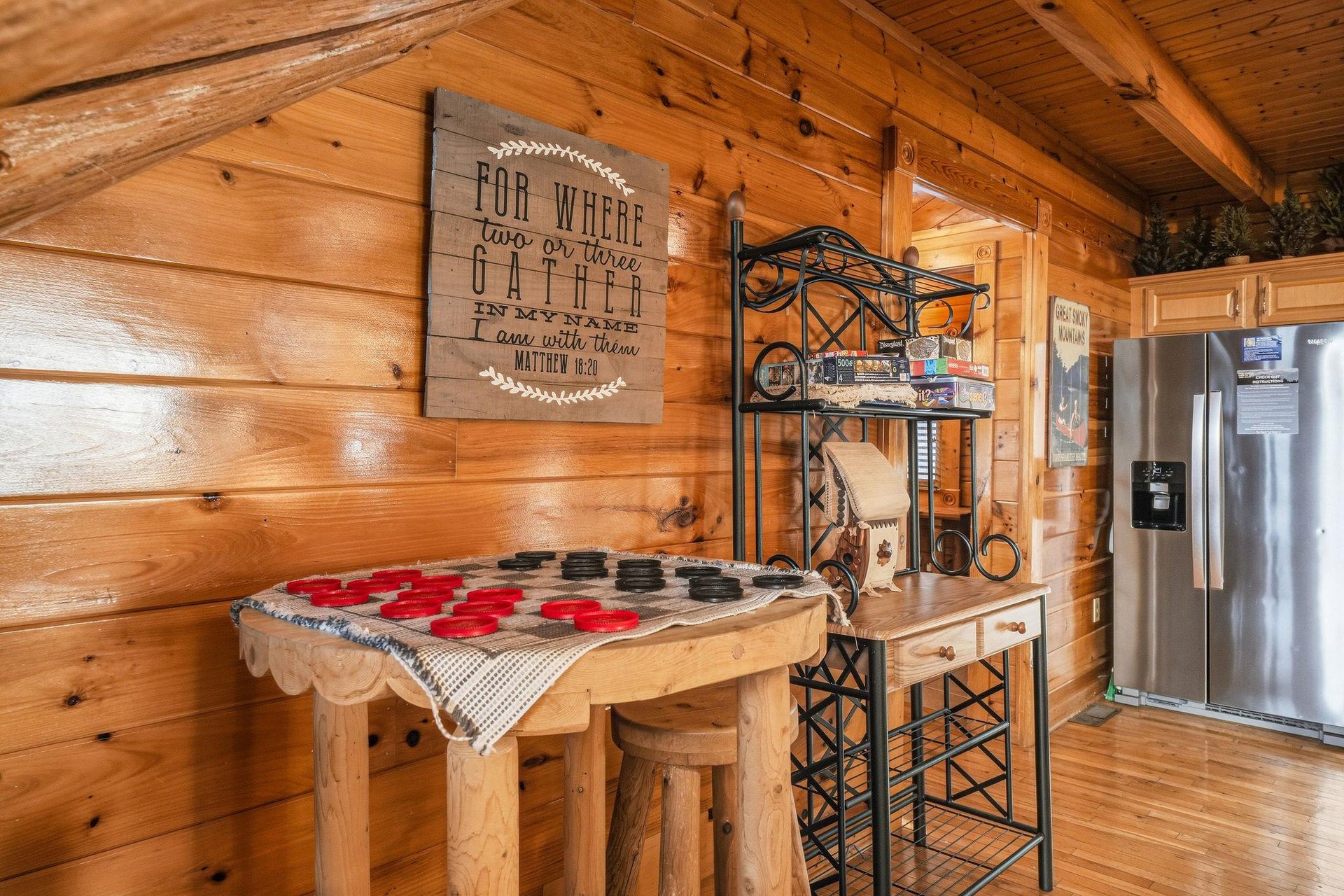 Your fullyequipped kitchen features a charming rustic feel, complete with a large refrigerator, cozy breakfast bar, and thoughtful touches that make cooking feel like home.
