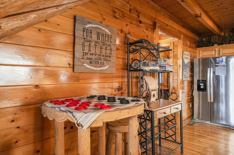 Your fullyequipped kitchen features a charming rustic feel, complete with a large refrigerator, cozy breakfast bar, and thoughtful touches that make cooking feel like home.