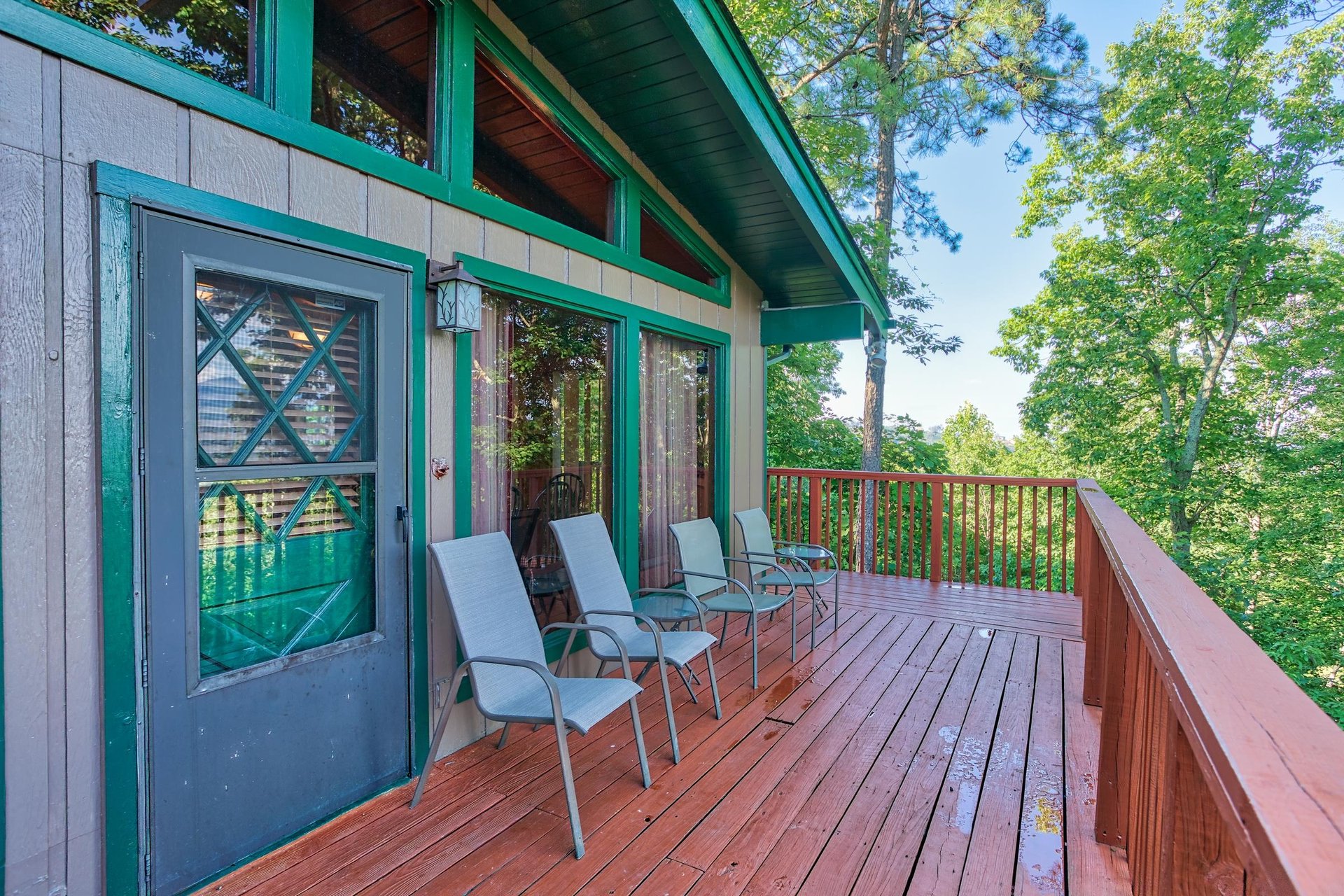 Main entrance and seating on the deck at Bushwood Lodge, a 3bedroom cabin rental located in Gatlinburg