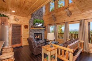 Living room with stone fireplace