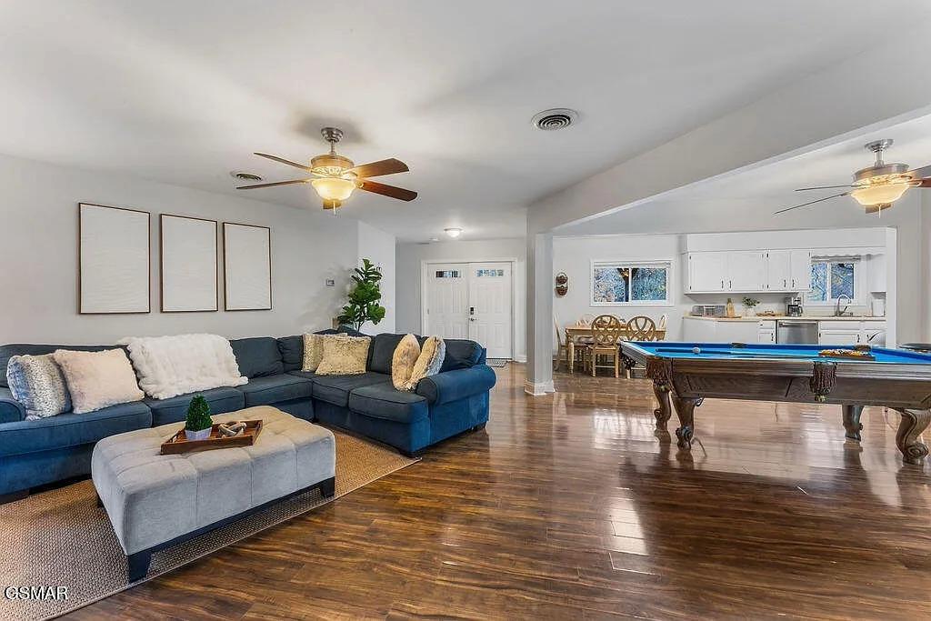 Unwind in your spacious living area where plush seating meets entertainment, with a pool table ready for friendly games.