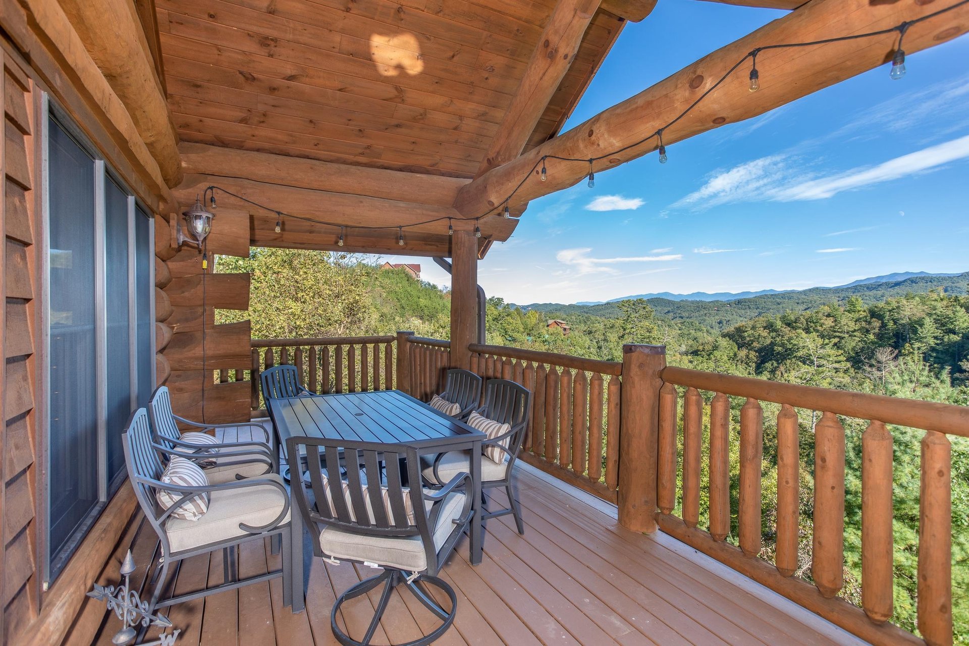 Mountain views from the dining space on the deck at Great View Lodge, a 5bedroom cabin rental located in Pigeon Forge