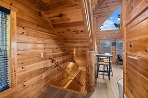 Stairway entrance from kitchen, leading to game room