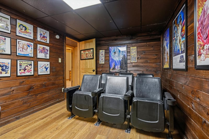 Step into your own vintage cinema with classic theater seating and walltowall movie poster nostalgia—perfect for cozy movie nights at home.