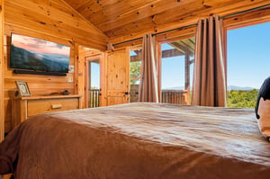 Wake up to sweeping mountain views framed by warm knotty pine and floortoceiling windows. Your private balcony invites you to step outside and breathe it all in.