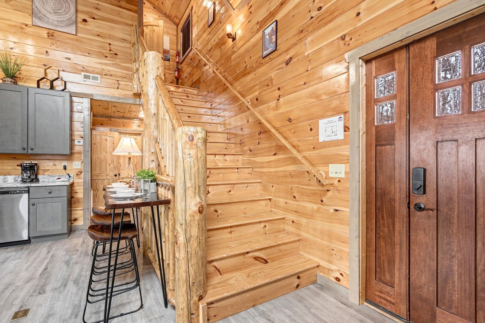 Step into this cozy cabin where rustic wood beams and warm lighting create your perfect mountain retreat atmosphere.