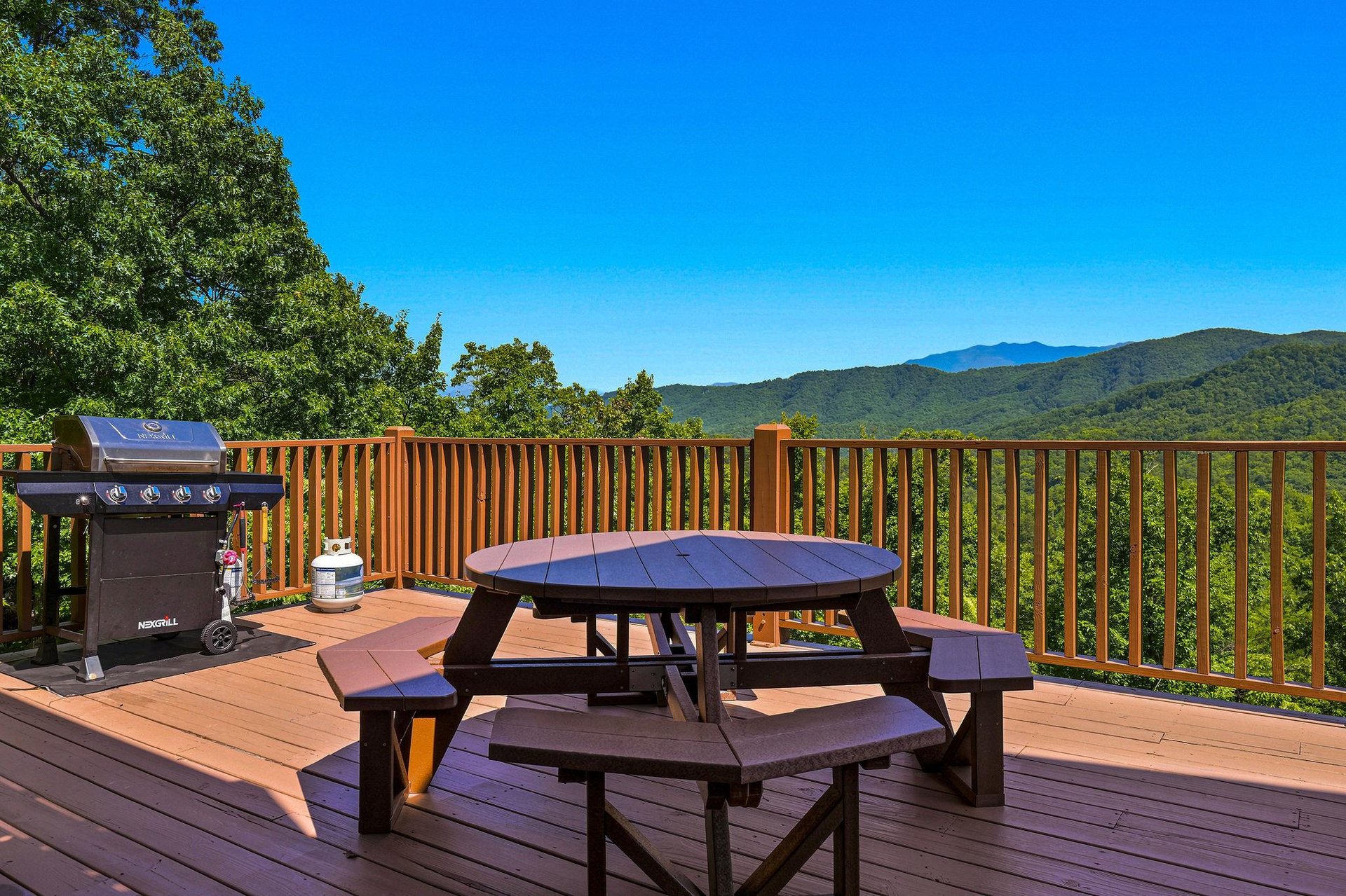 Picture yourself grilling on your private deck, surrounded by sweeping mountain vistas and fresh air. This peaceful outdoor space invites you to dine al fresco, sip morning coffee, or simply soak in t