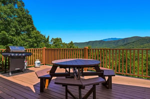 Picture yourself grilling on your private deck, surrounded by sweeping mountain vistas and fresh air. This peaceful outdoor space invites you to dine al fresco, sip morning coffee, or simply soak in t
