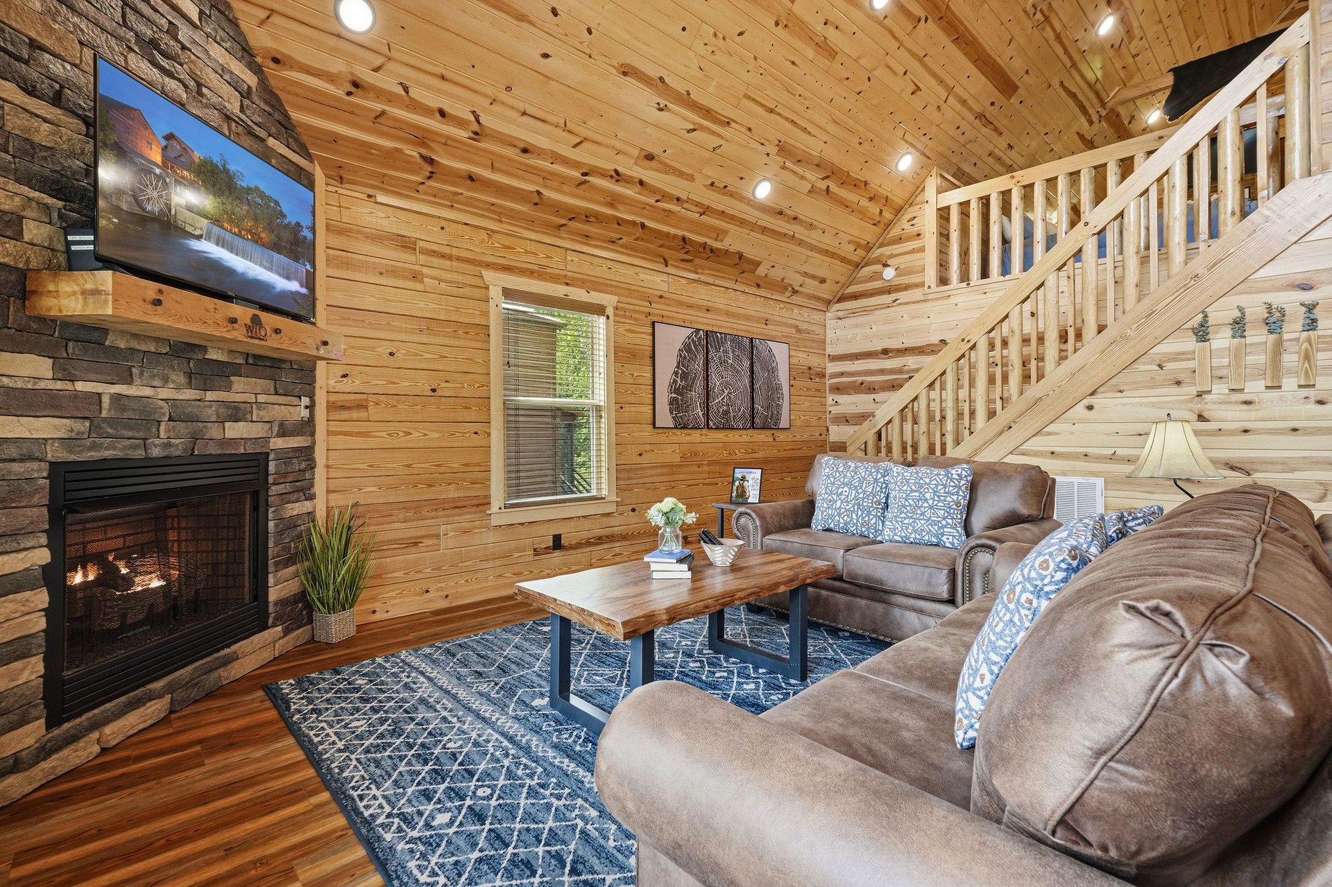 Sink into plush leather seating by the warm glow of your stone fireplace. Vaulted wood ceilings and soft lighting create a cozy mountain retreat feel thats perfect for unwinding after a day of advent