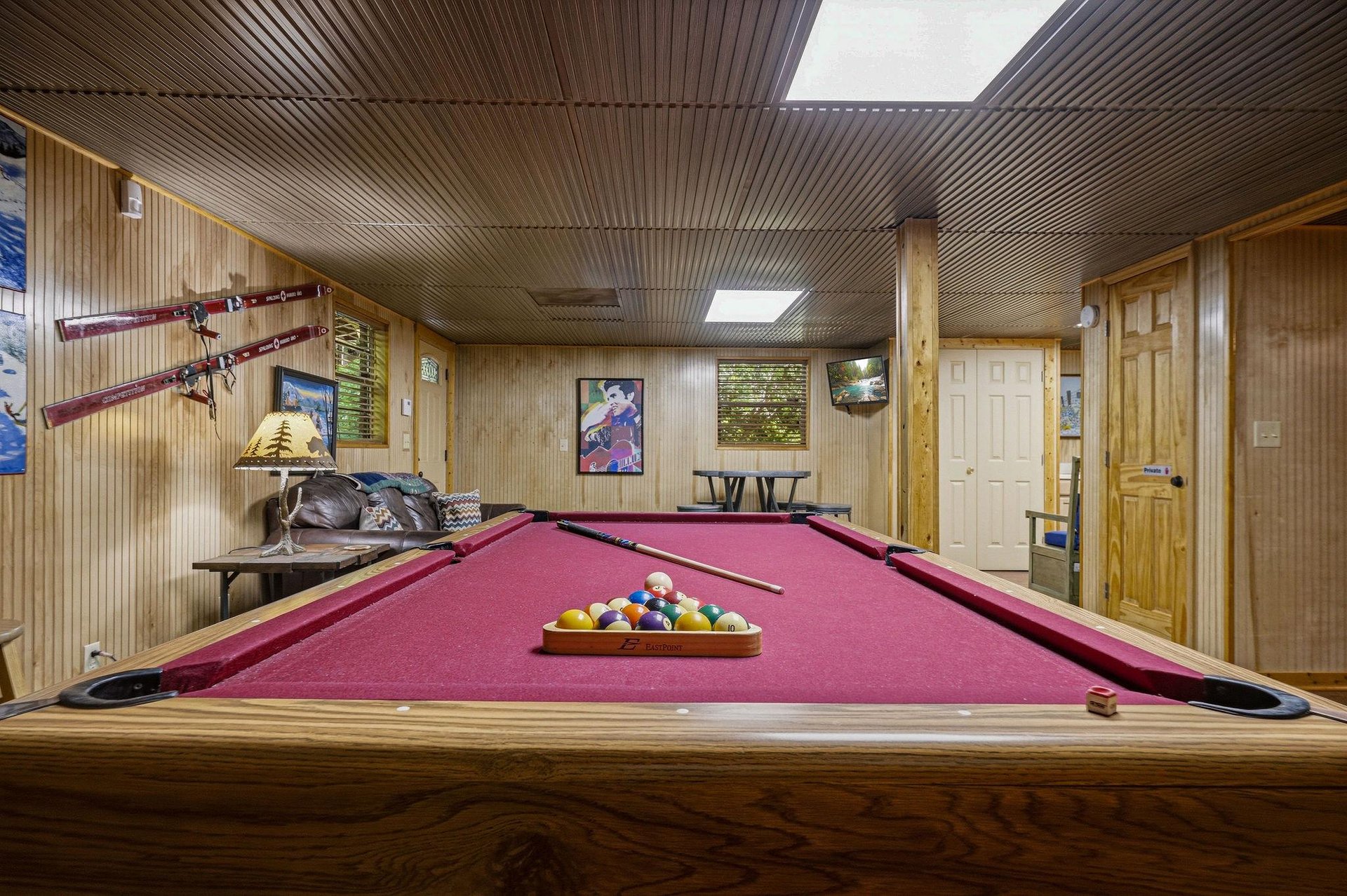 Challenge your friends to a friendly game in your own private billiards room, complete with rustic wood paneling and ski lodge charm.
