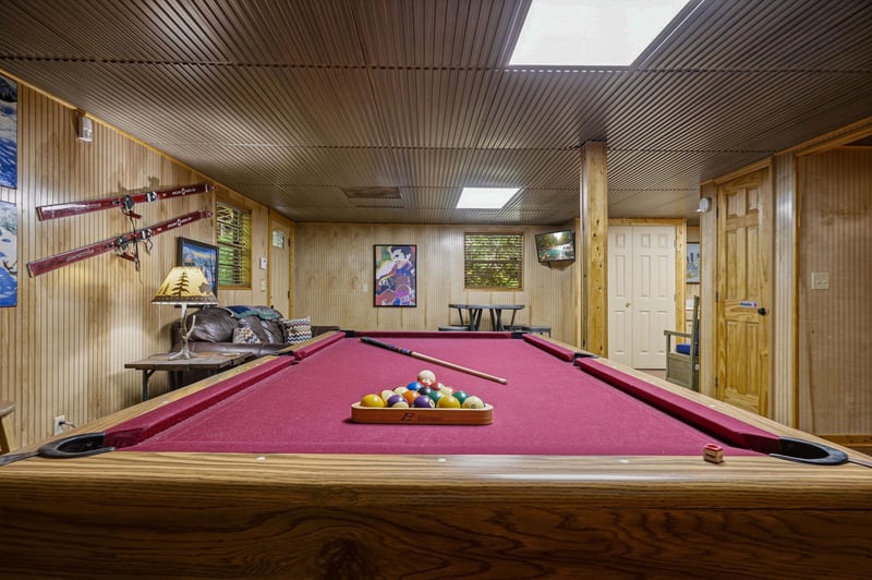 Challenge your friends to a friendly game in your own private billiards room, complete with rustic wood paneling and ski lodge charm.