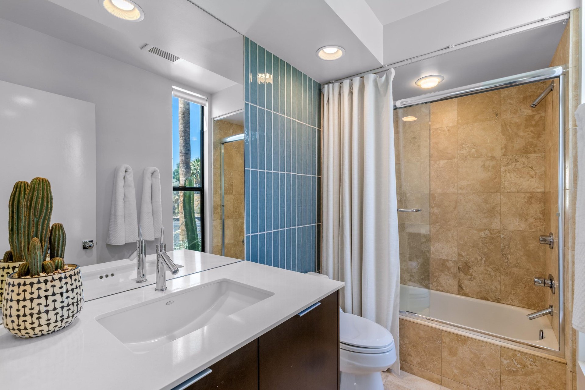 Ensuite bathroom with showertub combination.