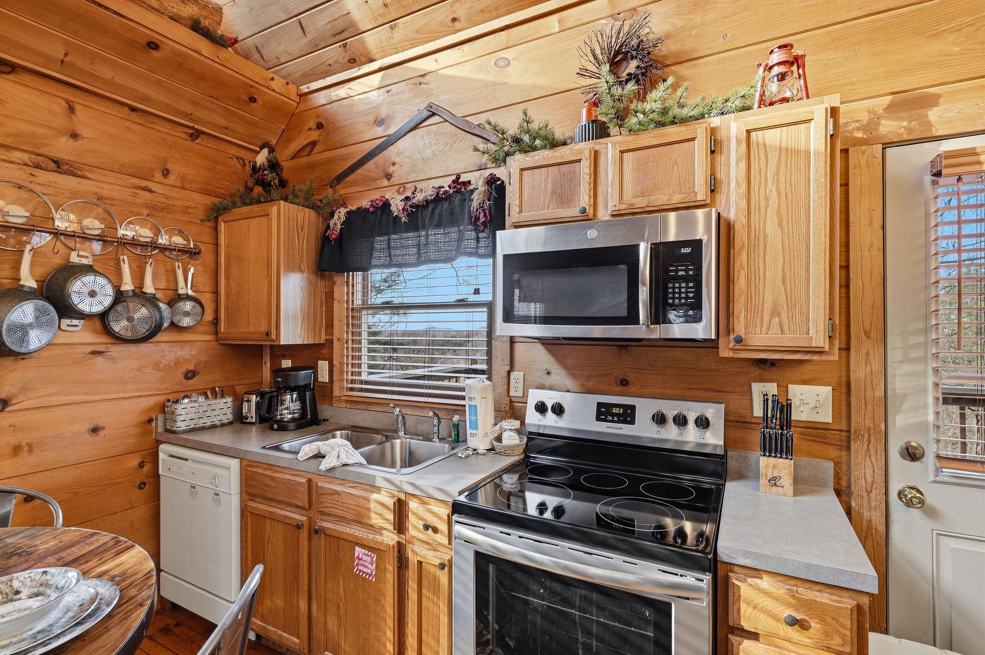 Your fully equipped rustic kitchen features warm wood cabinets and all the appliances you need to prepare memorable meals during your stay.