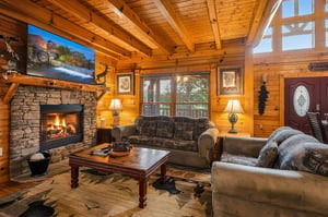 Sink into plush seating by your roaring fireplace and feel the warmth embrace you. The vaulted wood ceiling and natural light create a cozy mountain retreat where you can truly unwind.