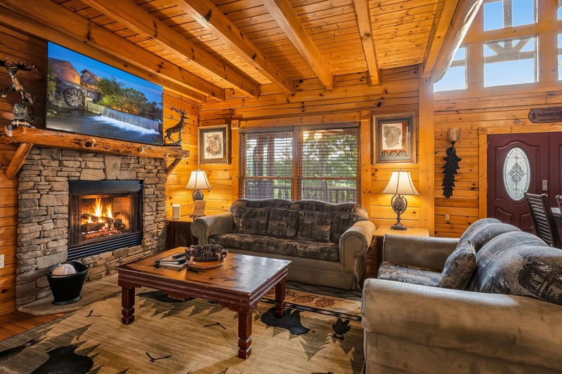 Sink into plush seating by your roaring fireplace and feel the warmth embrace you. The vaulted wood ceiling and natural light create a cozy mountain retreat where you can truly unwind.