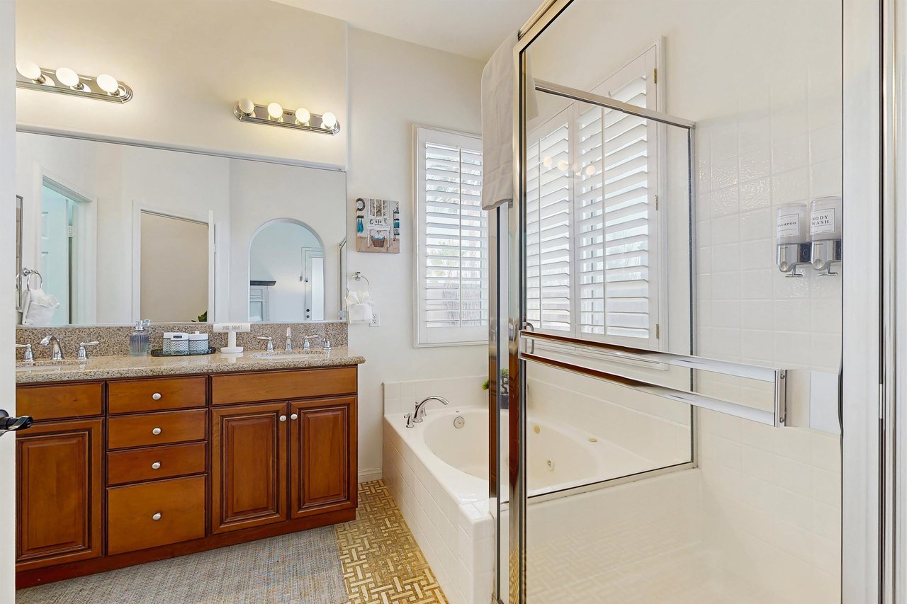 Walkin shower, jet tub, and dual vanity sinks.