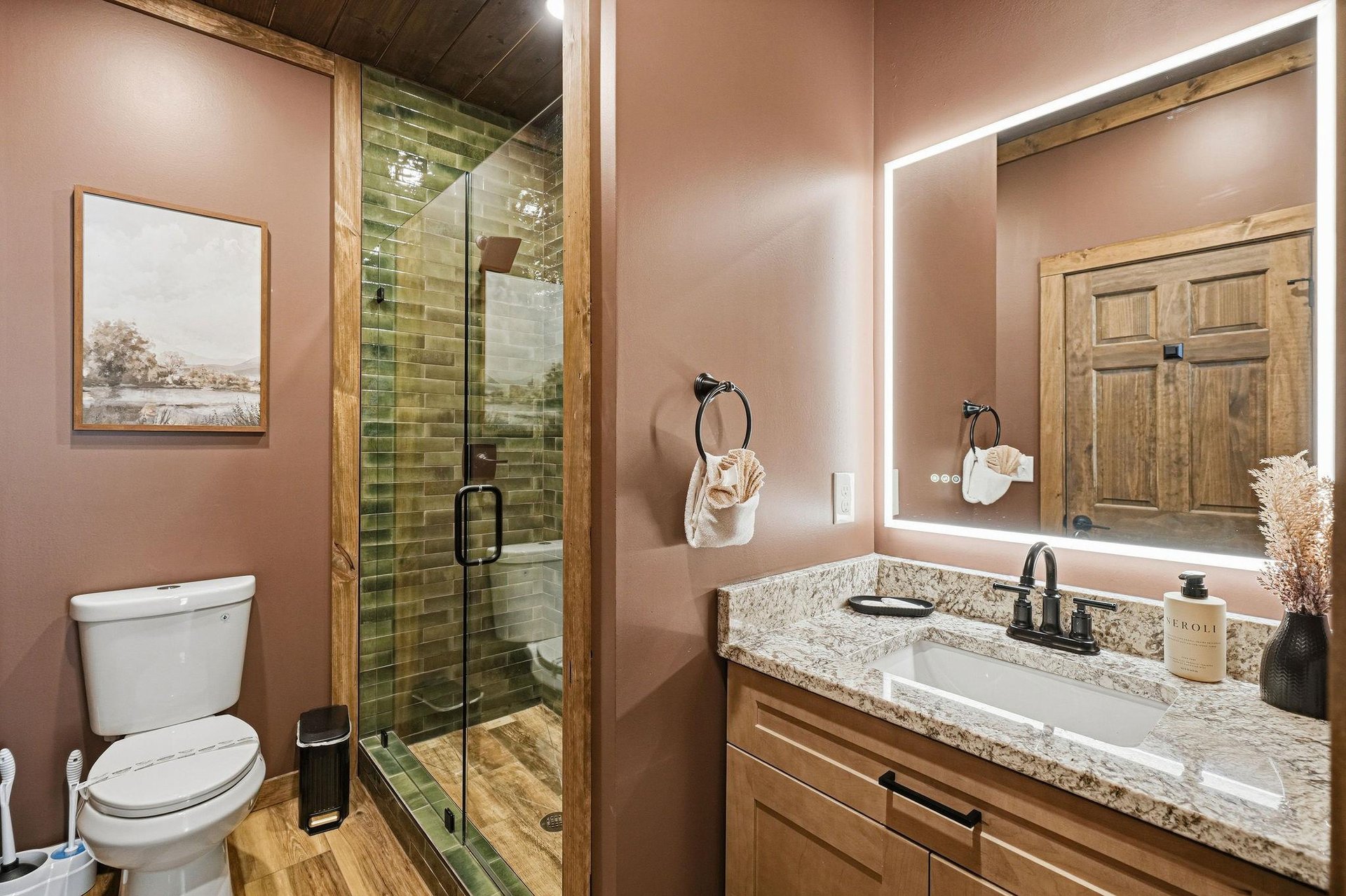 Step into your spalike bathroom with elegant granite counters, rustic wood cabinetry, and a stunning tiled shower that feels like your own private retreat.
