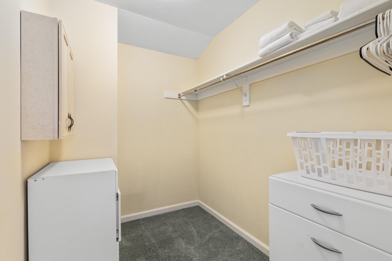 Walkin closet in primary room.