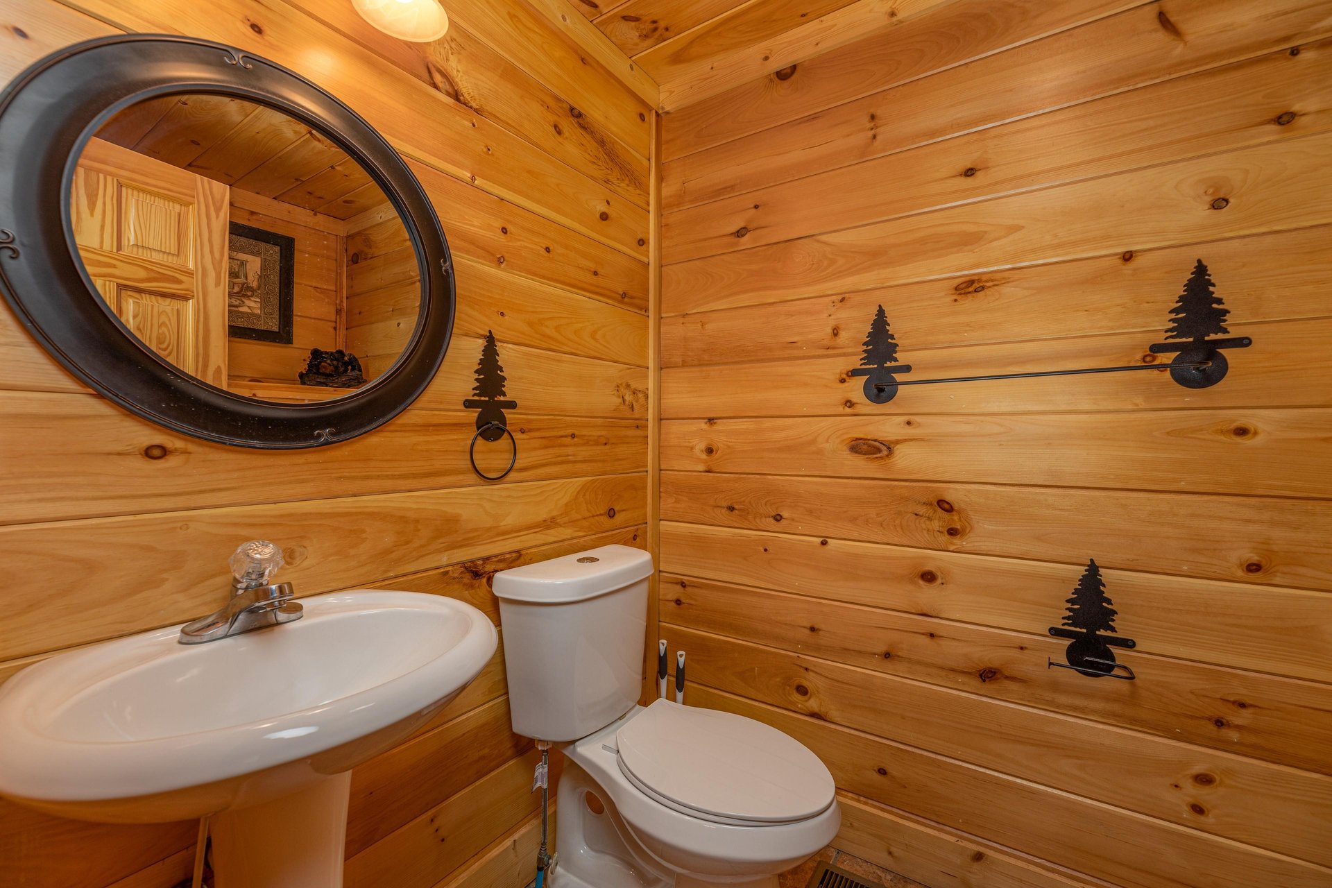 Half bath at Bears Dont Bluff, a 3 bedroom cabin rental located in Pigeon Forge
