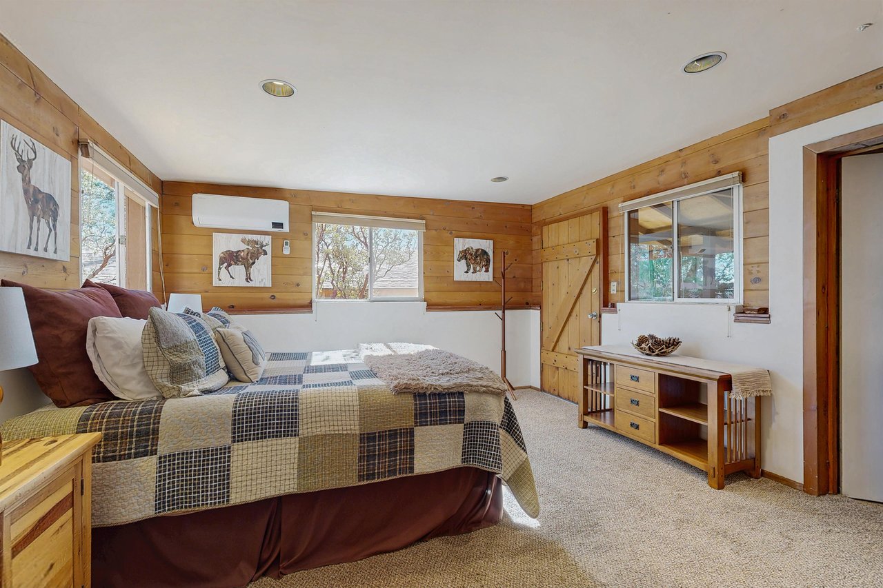 Downstairs bedroom with queen bed, remote controlled minisplit, and private entrance.