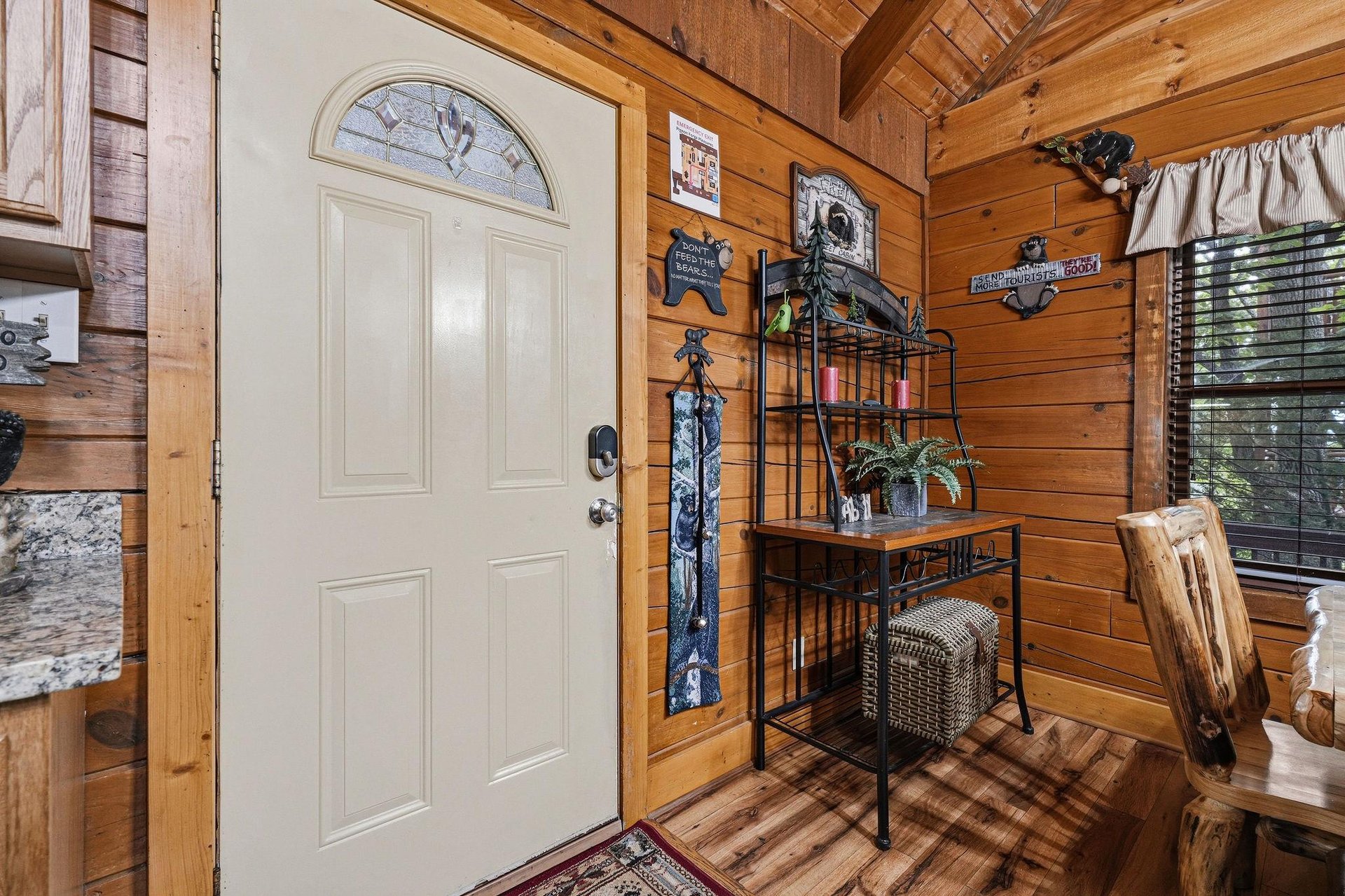 Warm wood beams and walls welcome you into your cozy cabin retreat, where rustic charm meets inviting comfort from the moment you step inside.