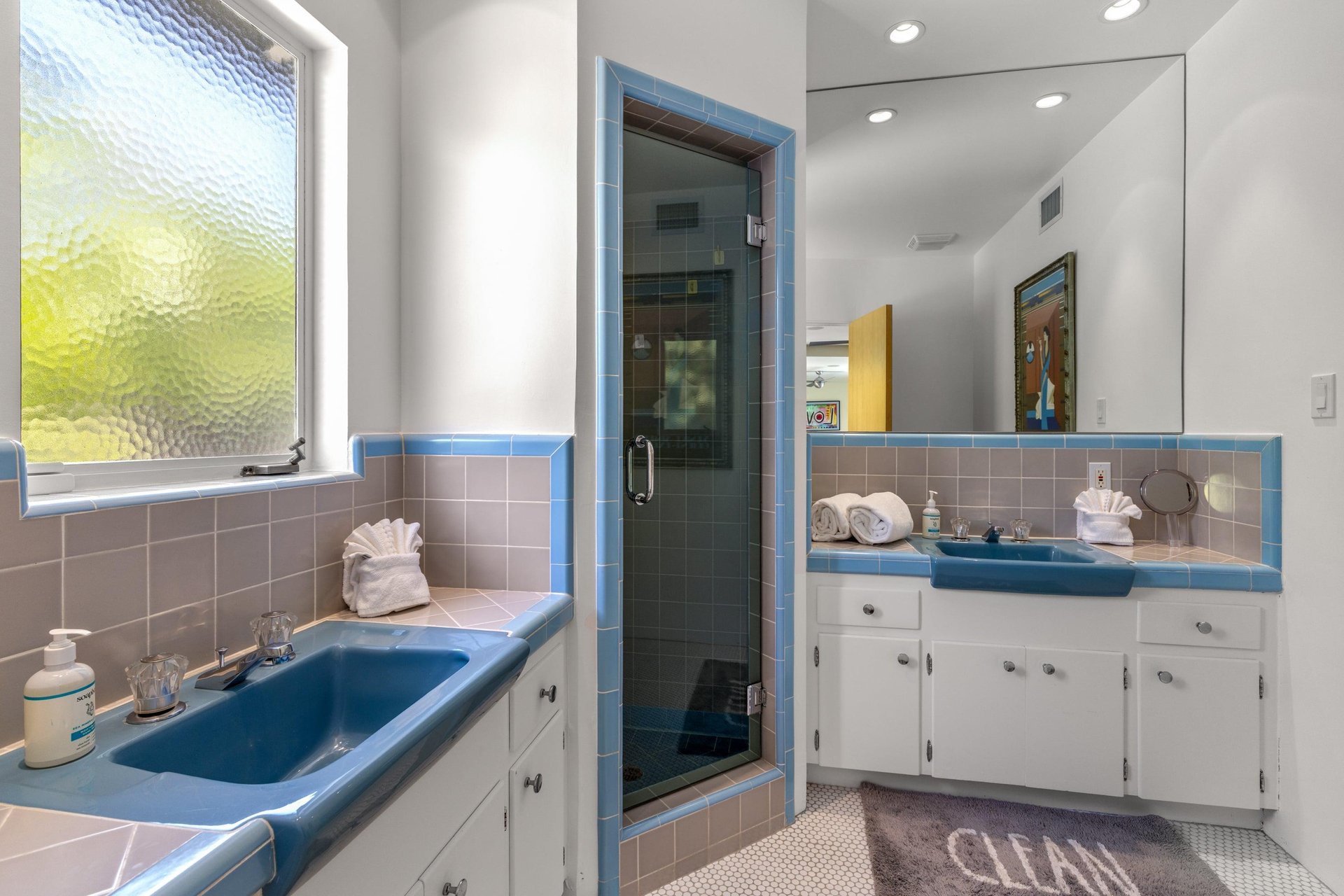 Ensuite bathroom with dual vanity sinks and a standalone shower.