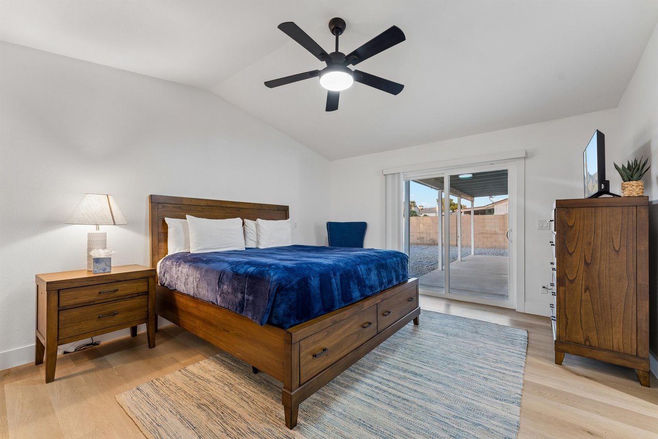 King size bed, flat screen TV, patio access, and ensuite bathroom.