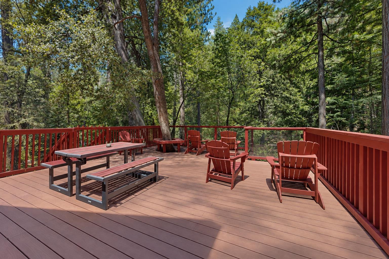 Gather around the picnic table or sink into the Adirondack chairs on the spacious deck, surrounded by towering pines — a great spot for outdoor meals or just soaking in the mountain air.