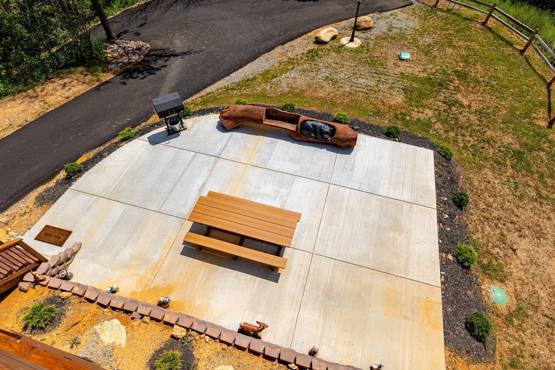 Picnic table with grill and log seat