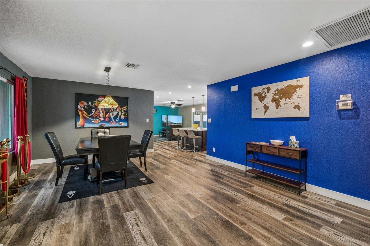 Dining space for 4, with additional room to pull in chairs for more guests. Remove the leaf on top of the table to reveal the custom game table