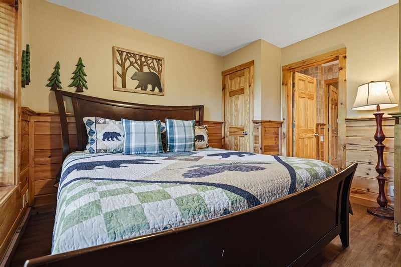 Unwind in your cozy woodlandthemed bedroom with comfortable quilted bedding and charming rustic décor that creates the perfect mountain retreat atmosphere.