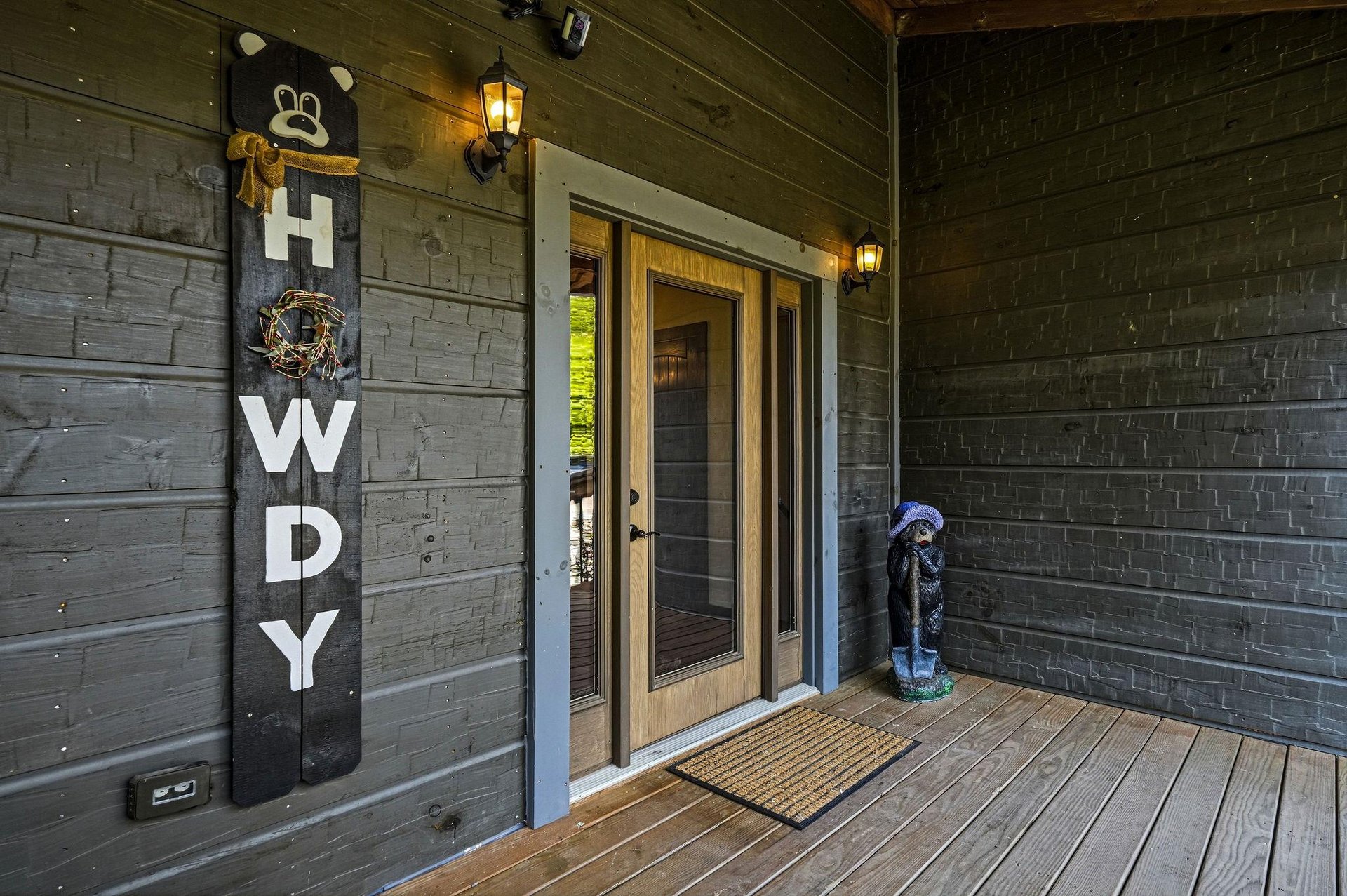 The cabins entrance features charming rustic details and warm lighting to guide your arrival.