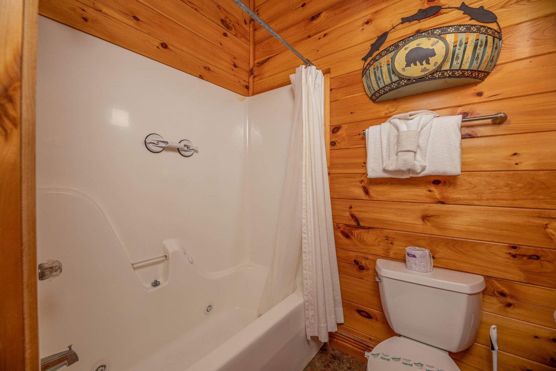 Bathroom with a tub and shower at Gone Fishin, a 2bedroom cabin rental located in Pigeon Forge