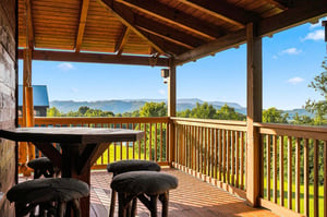 Step out onto your private covered deck and take in sweeping mountain vistas—perfect for morning coffee or evening relaxation surrounded by natures beauty.