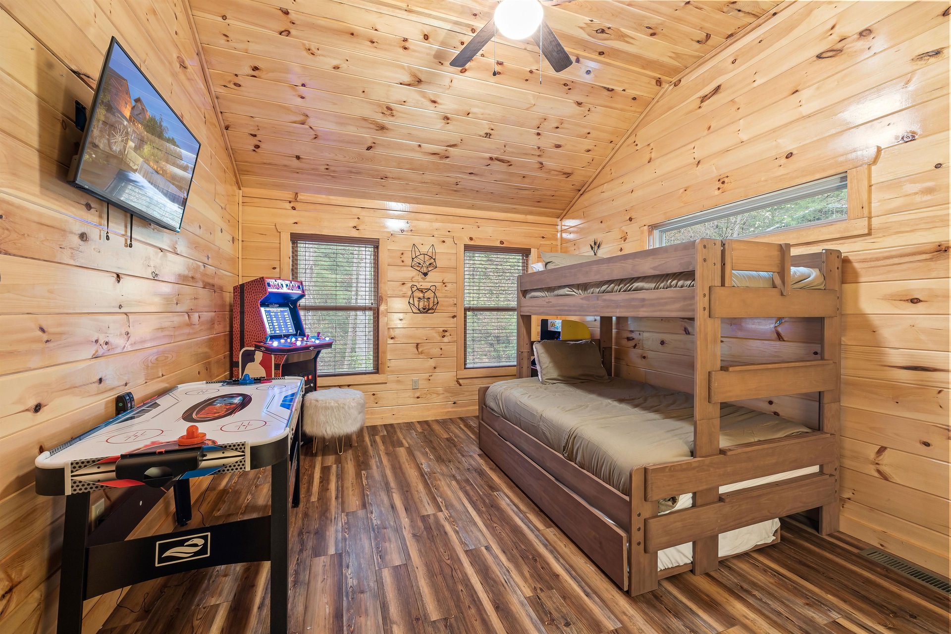 Bunk with arcade game and air hockey table