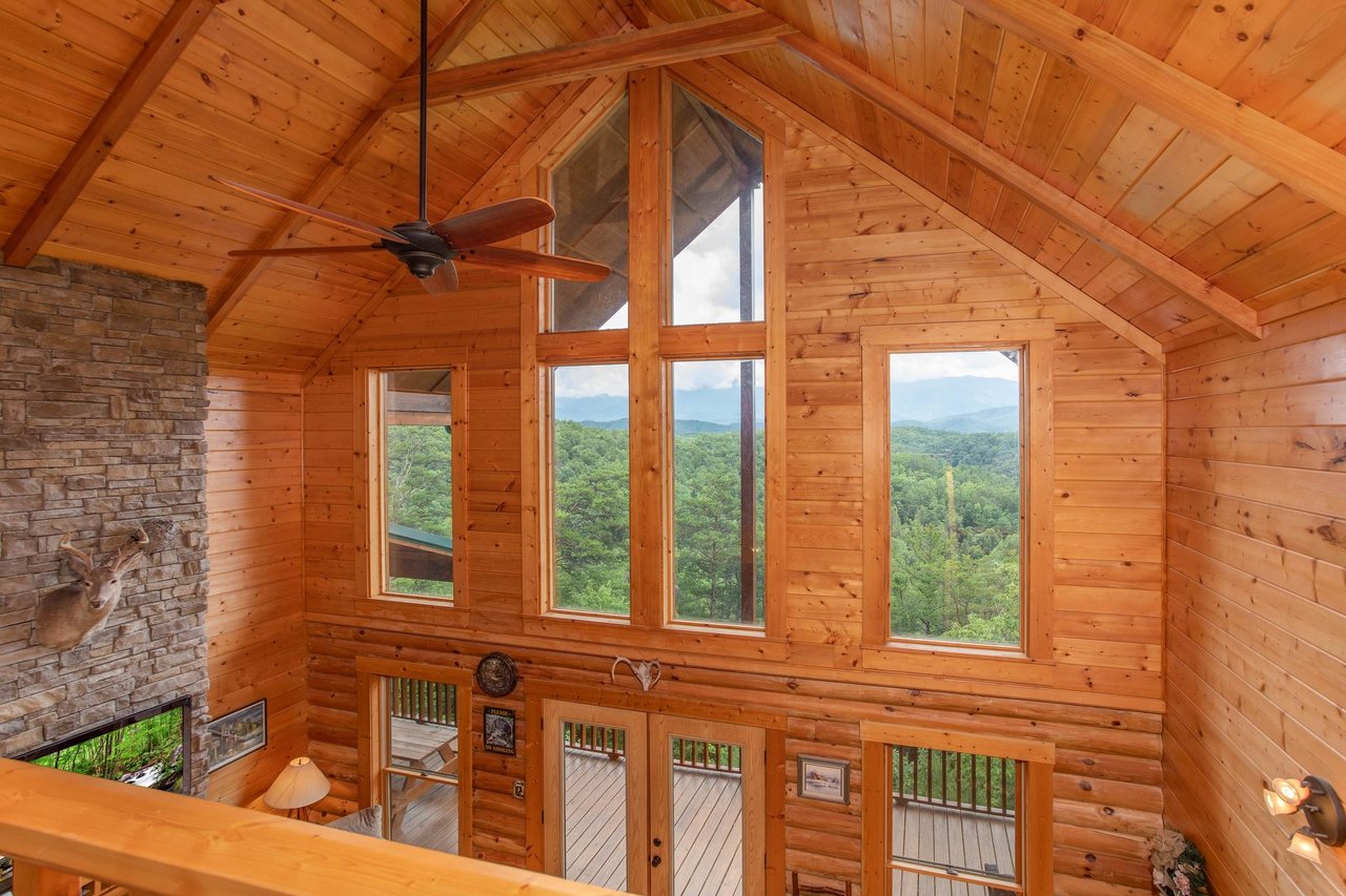 Big windows with view on living room wall