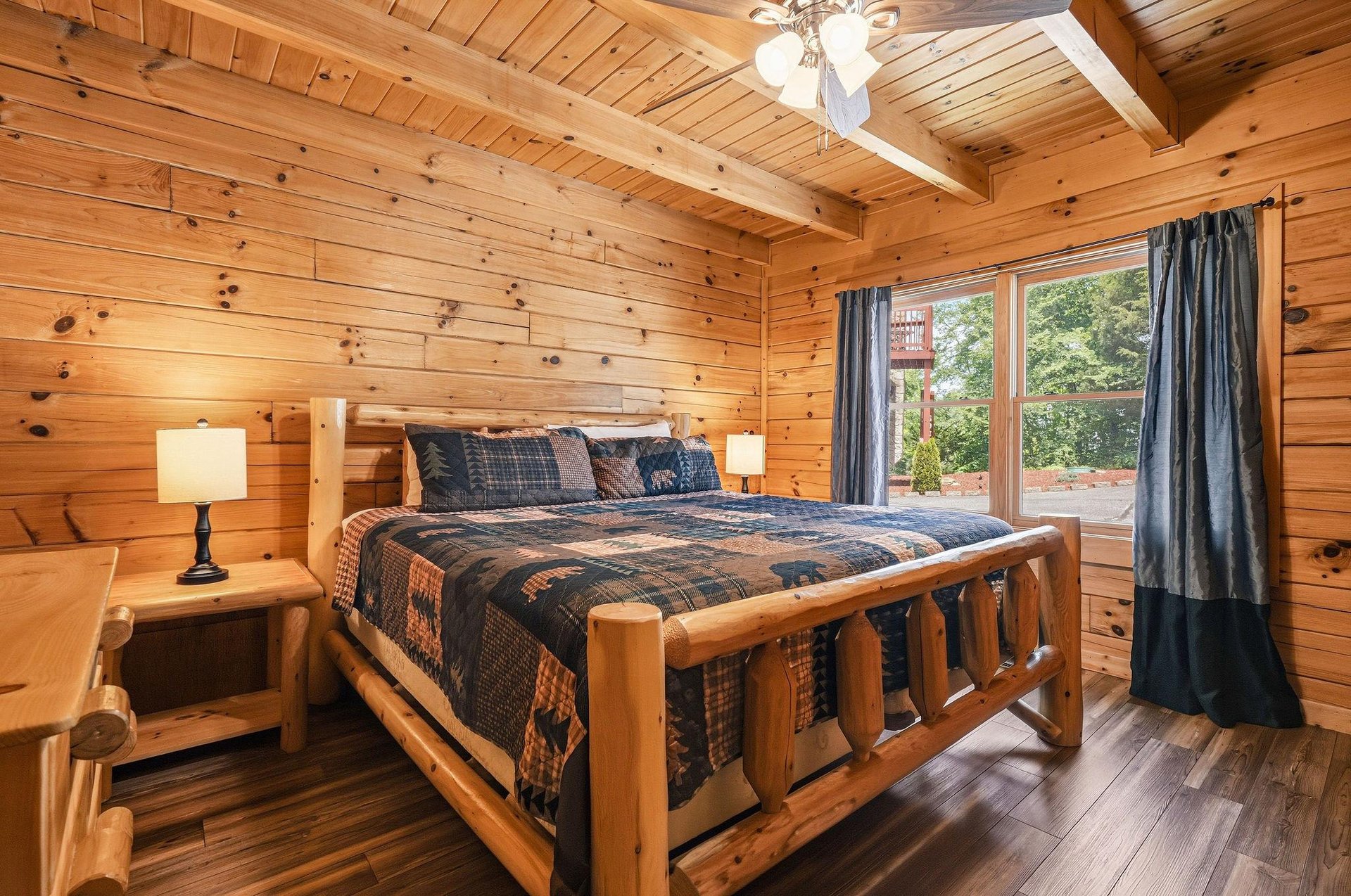 Sink into your rustic log bed beneath soaring woodbeamed ceilings. Natural light and forest views create a cozy cabin escape where youll rest deeply after exploring nearby trails.