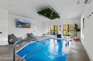 Slip into your private indoor pool whenever you like—pure luxury, peace, and lush greenery overhead make this your perfect escape.