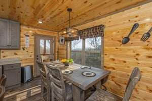 Dining table for six at Everlys Splash, a 4 bedroom cabin rental located in Pigeon Forge