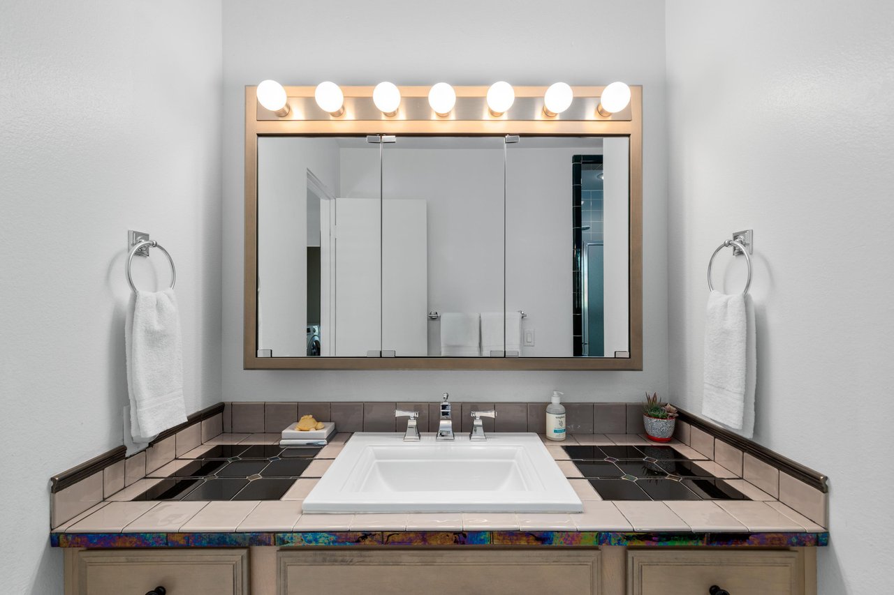 Vanity area with counter space.