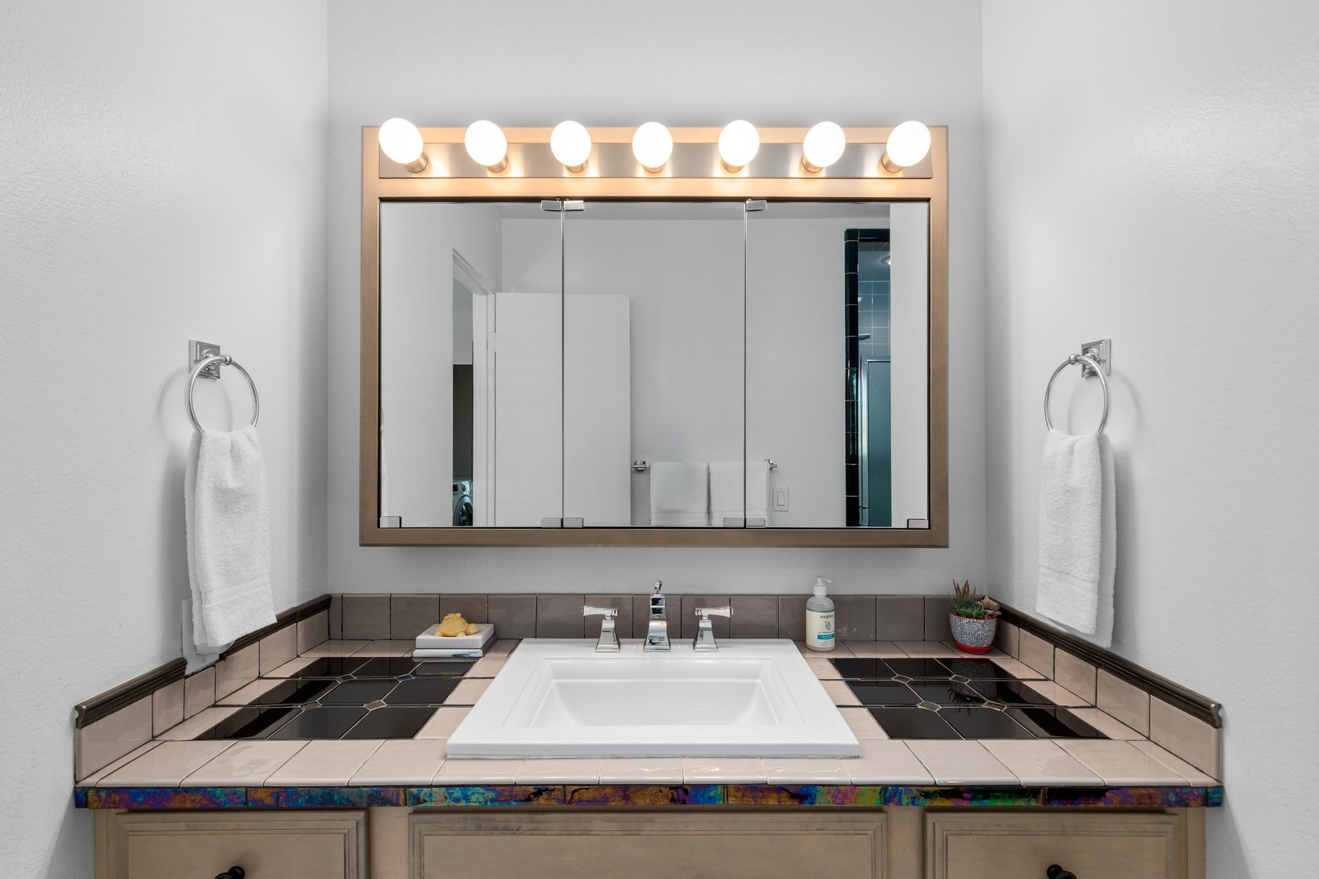 Vanity area with counter space.