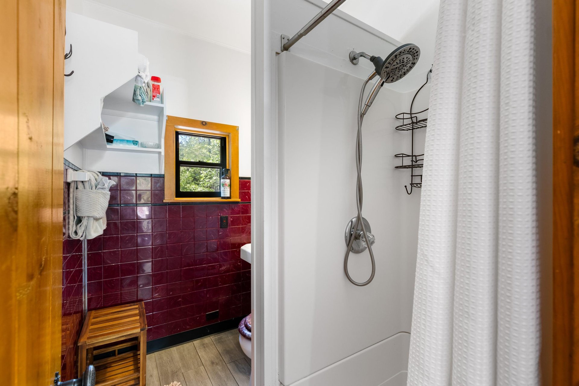 Ensuite bathroom with a walkin shower and detachable shower head.