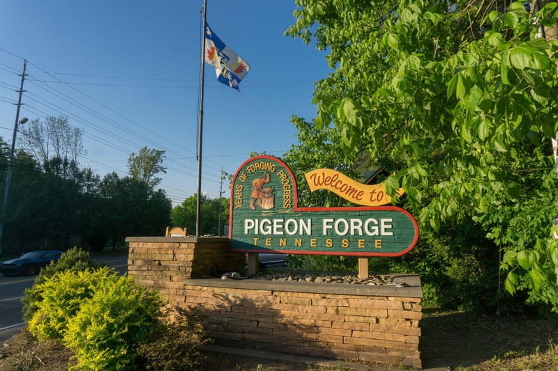 Welcome to Pigeon Forge, Tennessee This iconic town entrance sign marks your arrival at the gateway to Great Smoky Mountains adventures.