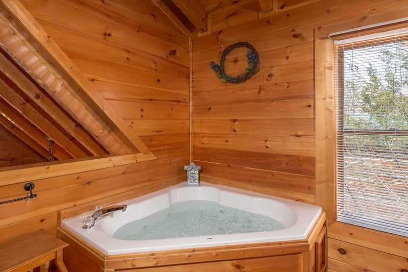 Jacuzzi in the loft bedroom at EllaVation, a 3 bedroom cabin rental located in Gatlinburg