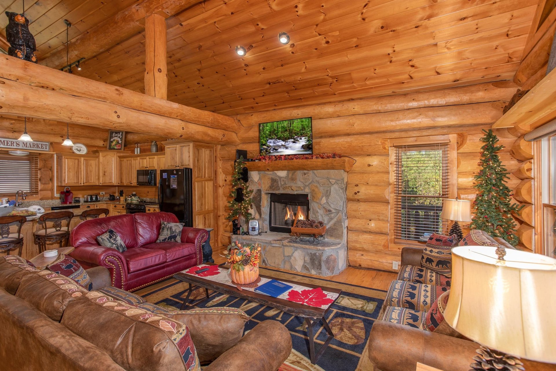 Fireplace and TV in the living room at Great View Lodge, a 5bedroom cabin rental located in Pigeon Forge